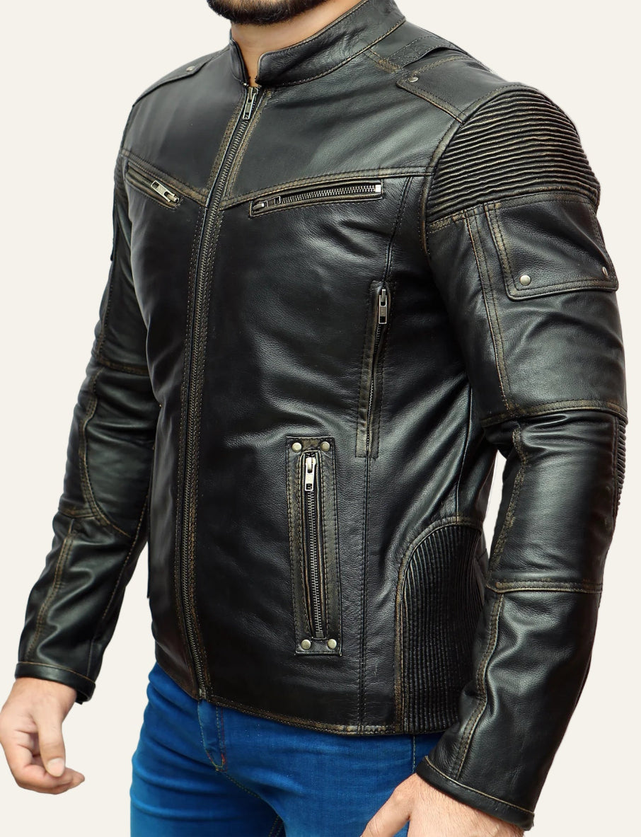 Black leather jacket with zippers and stitching details on a white background